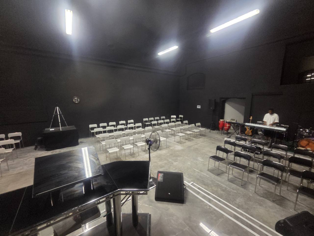 Angled view across the seating and music area inside the sanctuary