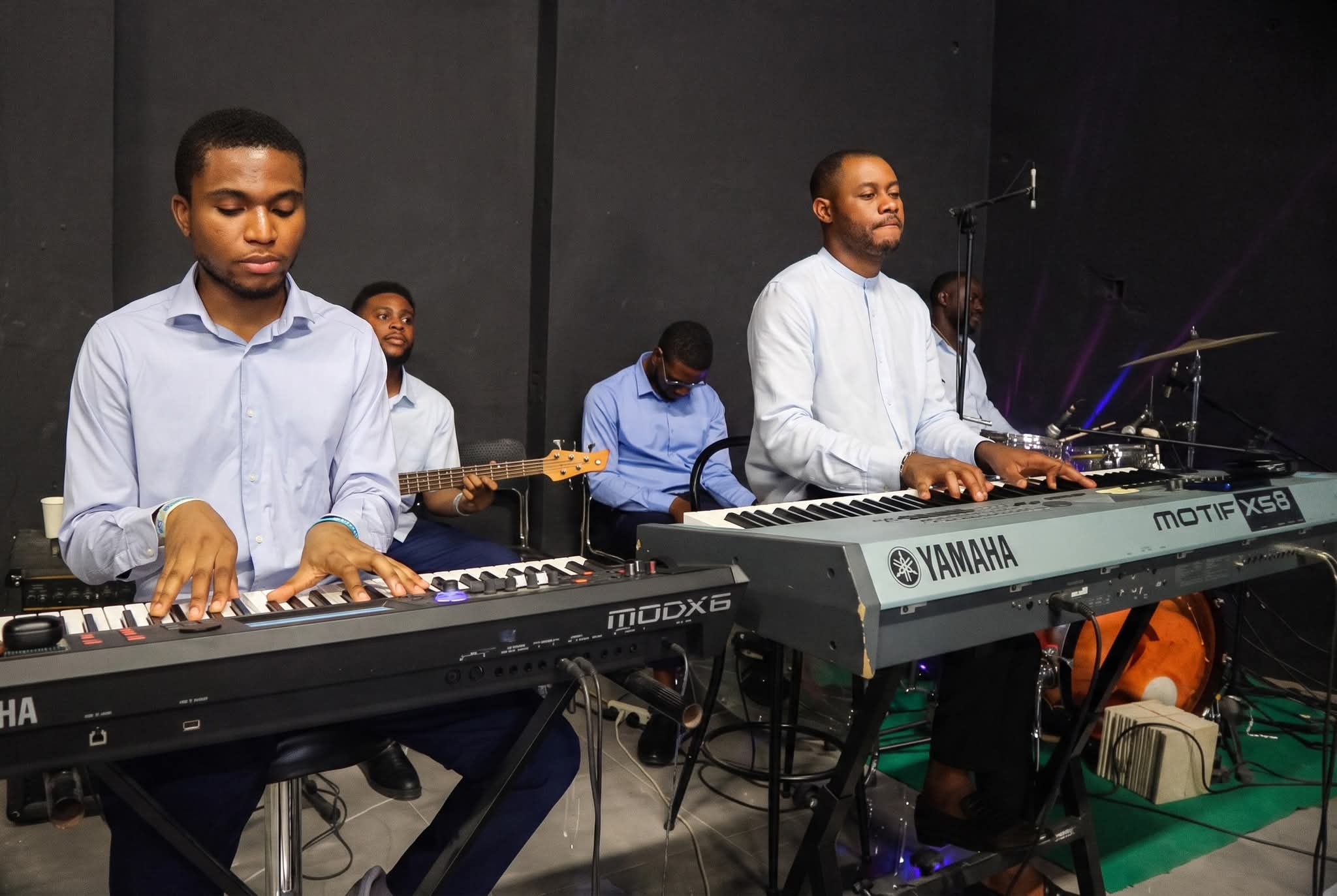 Rodwater musicians playing keyboards and guitar together